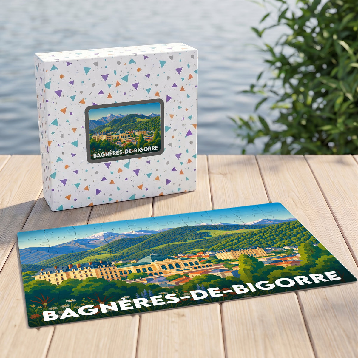 Puzzle souvenir de la ville de Bagnères-de-Bigorre présentant une illustration panoramique de la ville au pied des montagnes.