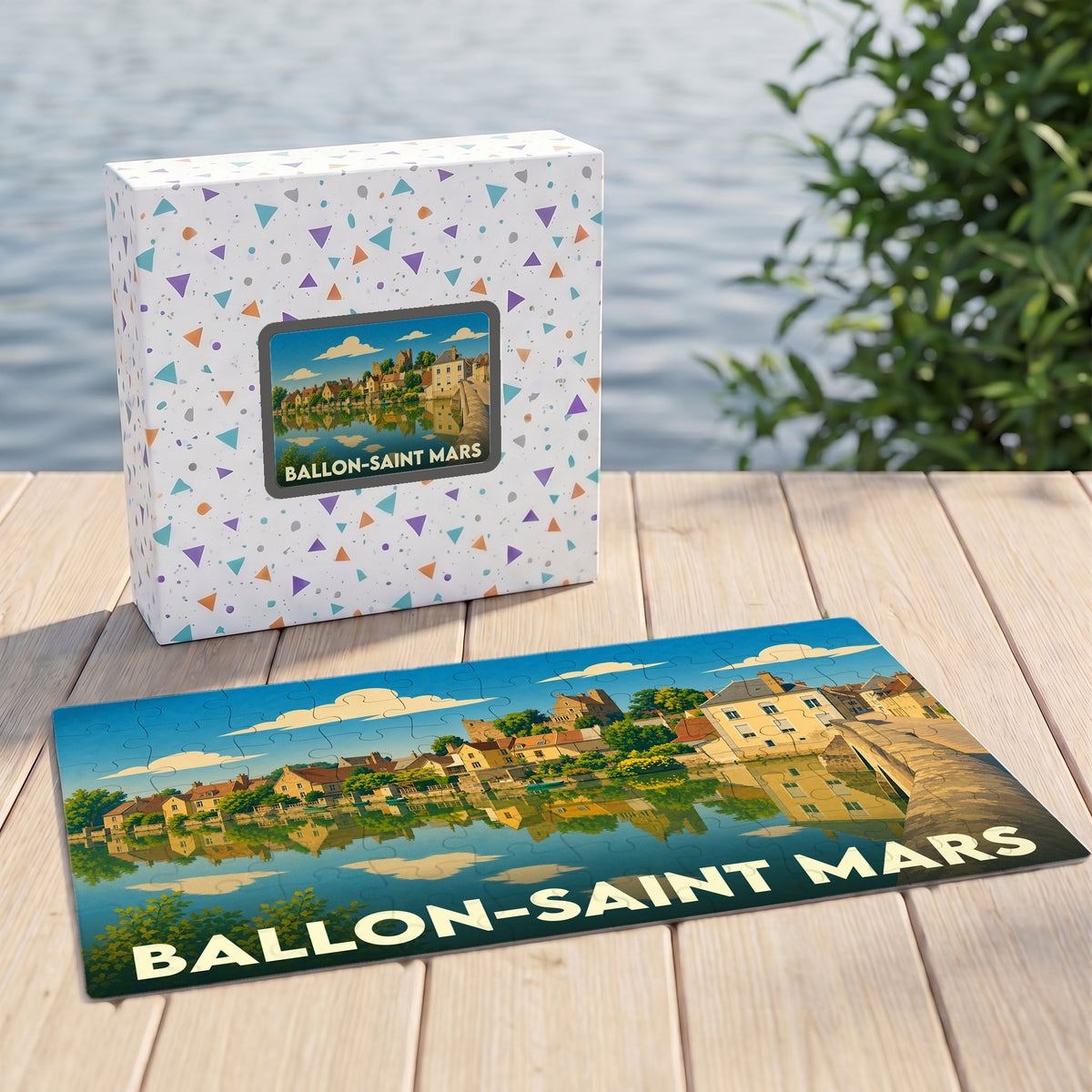 Puzzle souvenir de la ville de Ballon-Saint Mars illustré par un paysage urbain au bord de l'eau.