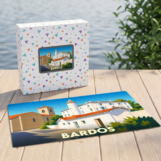 Puzzle souvenir de la ville de Bardos accompagné de sa boîte illustrée d'un paysage urbain stylisé.