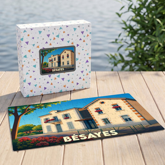 Puzzle souvenir de la ville de Bésayes illustrant une maison traditionnelle stylisée dans une boîte décorée.