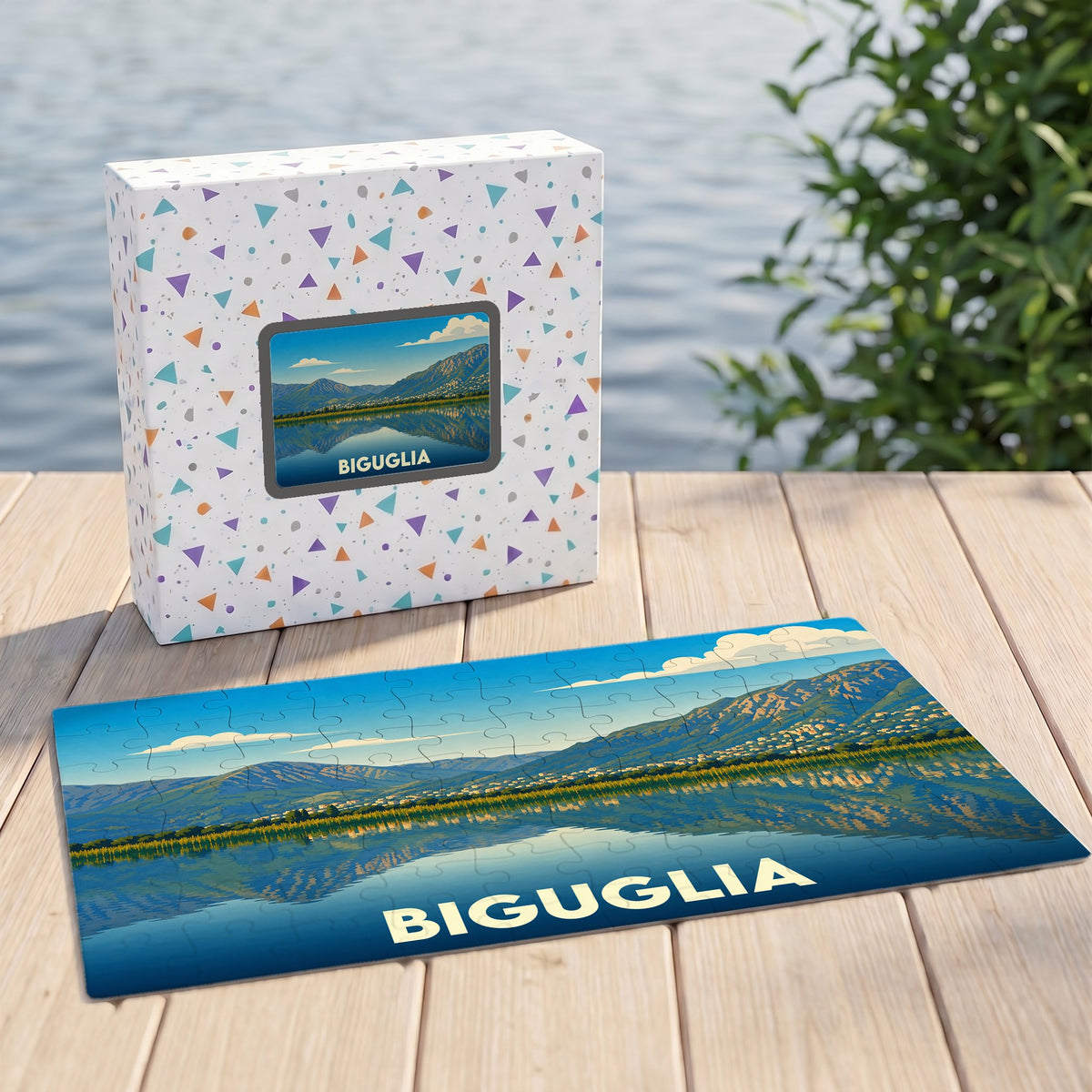 Puzzle souvenir de la ville de Biguglia avec une illustration stylisée d'un paysage montagneux se reflétant dans l'eau.