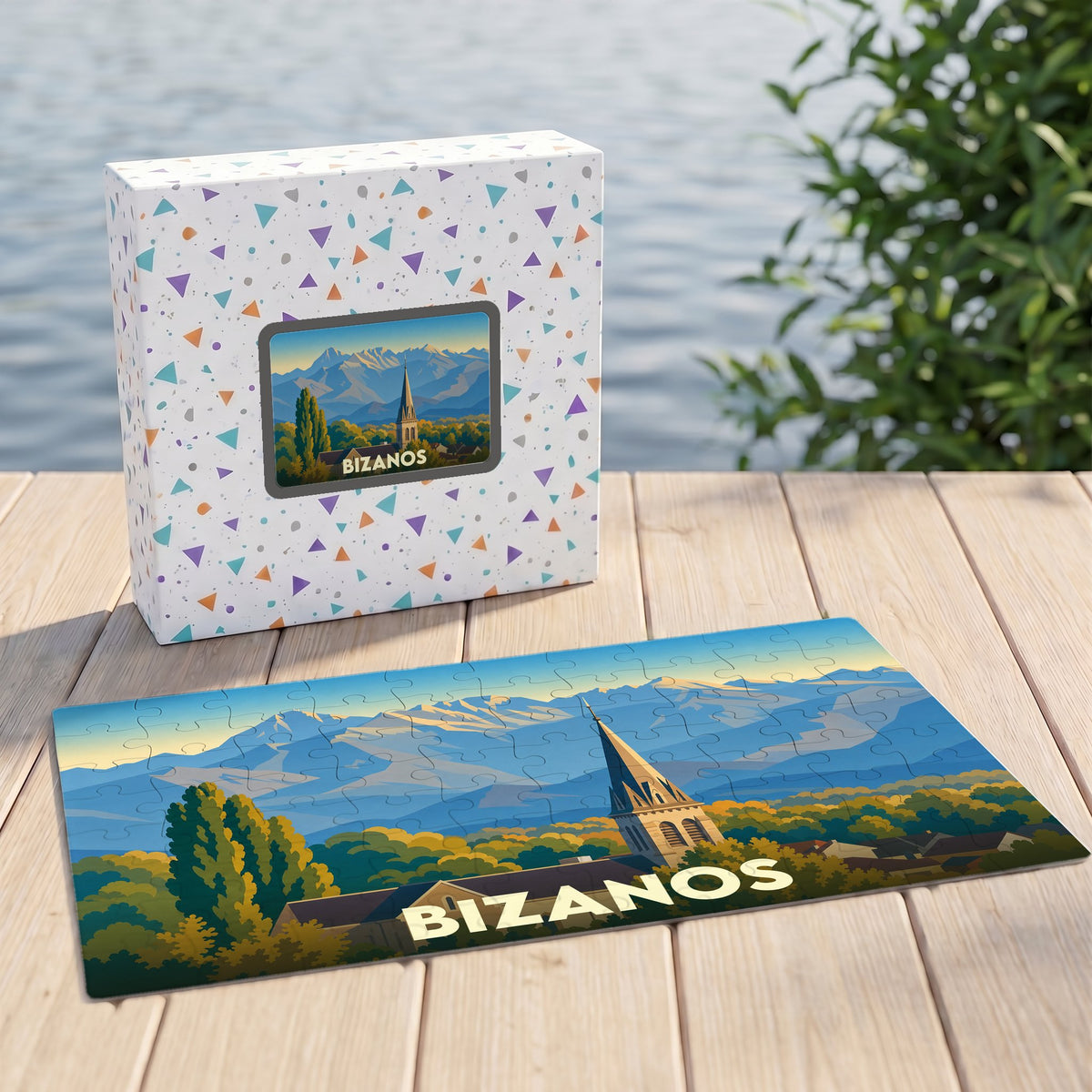 Puzzle souvenir de la ville de Bizanos illustrant un paysage montagneux avec son église.