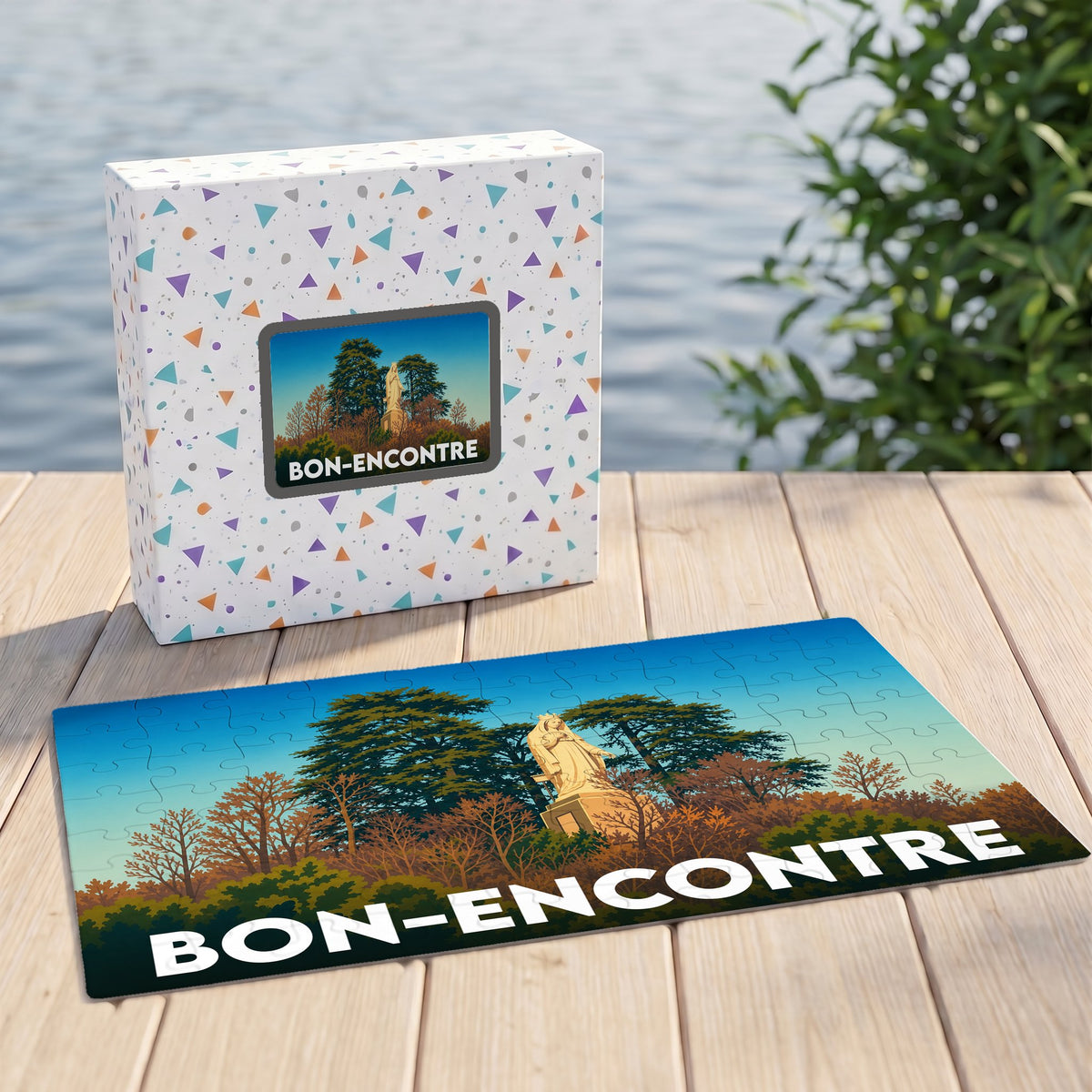 Puzzle souvenir de la ville de Bon-Encontre illustrant une statue dans un parc paysager.
