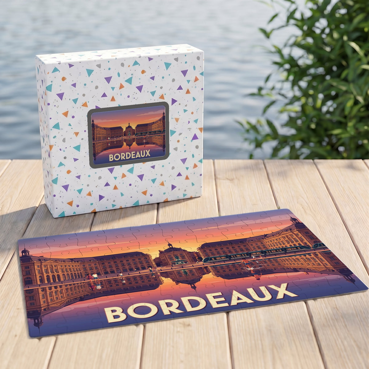 Puzzle souvenir de la ville de Bordeaux avec une illustration stylisée de la place de la Bourse au coucher du soleil.