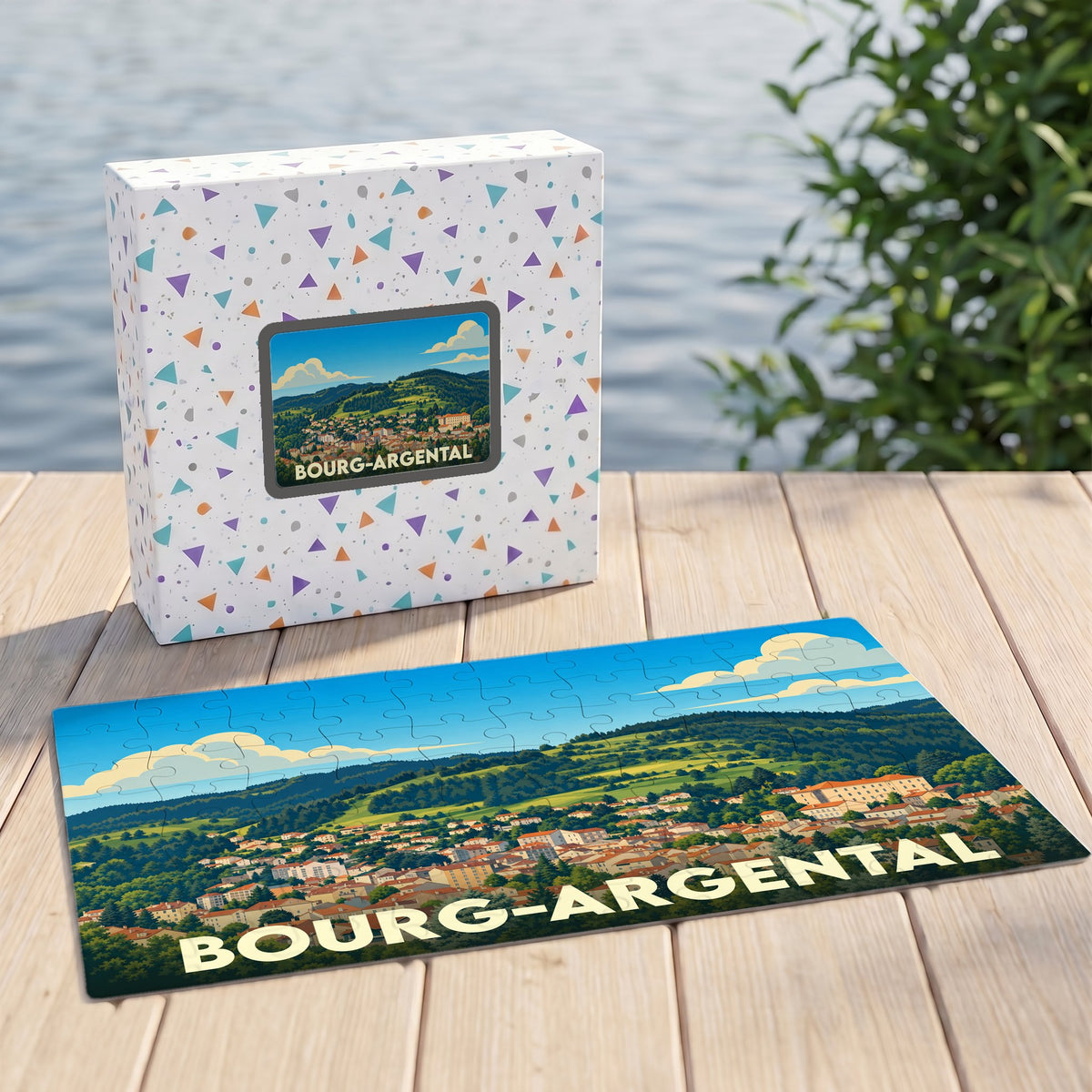 Puzzle souvenir de la ville de Bourg-Argental représentant un paysage vallonné illustré.