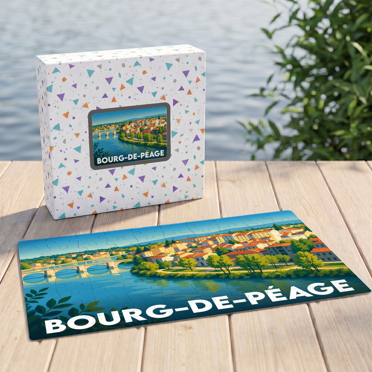 Puzzle souvenir de la ville de Bourg-de-Péage illustrant un paysage fluvial coloré.