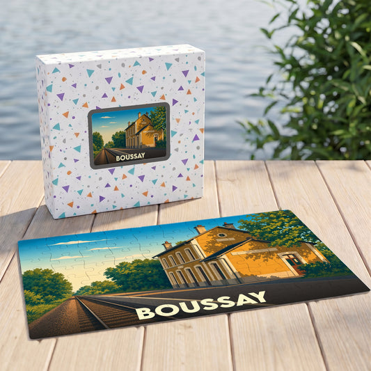 Puzzle souvenir de la ville de Boussay avec une illustration stylisée d'un bâtiment en bord de voie ferrée.