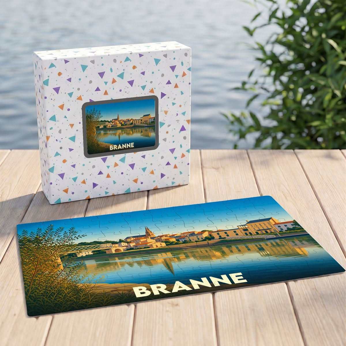 Puzzle souvenir de la ville de Branne illustré d'un paysage urbain au bord de l'eau.