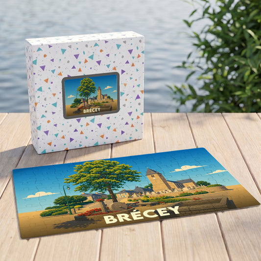 Puzzle souvenir de la ville de Brécey accompagné de sa boîte, illustré par un dessin stylisé de son église.