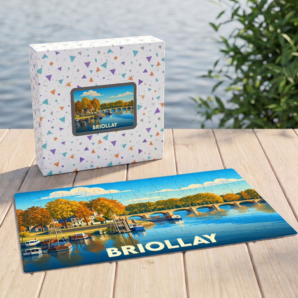 Puzzle souvenir de la ville de Briollay représentant un paysage fluvial illustré.