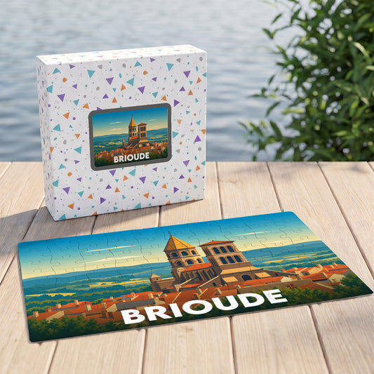 Puzzle souvenir de la ville de Brioude présentant une illustration stylisée de sa basilique dans son coffret assorti.