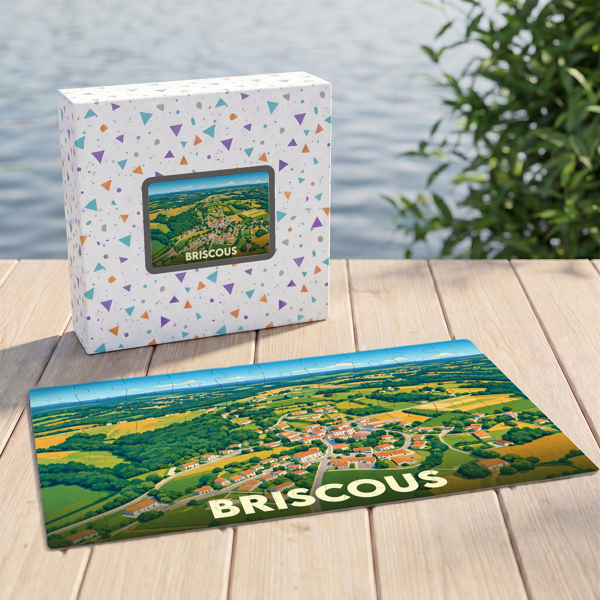 Puzzle souvenir de la ville de Briscous avec une illustration aérienne et colorée du paysage.