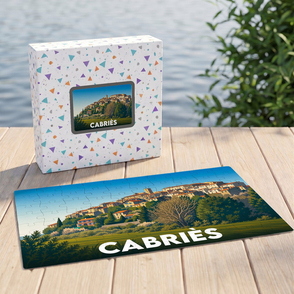 Puzzle souvenir de la ville de Cabriès avec une illustration stylisée d'un village perché.