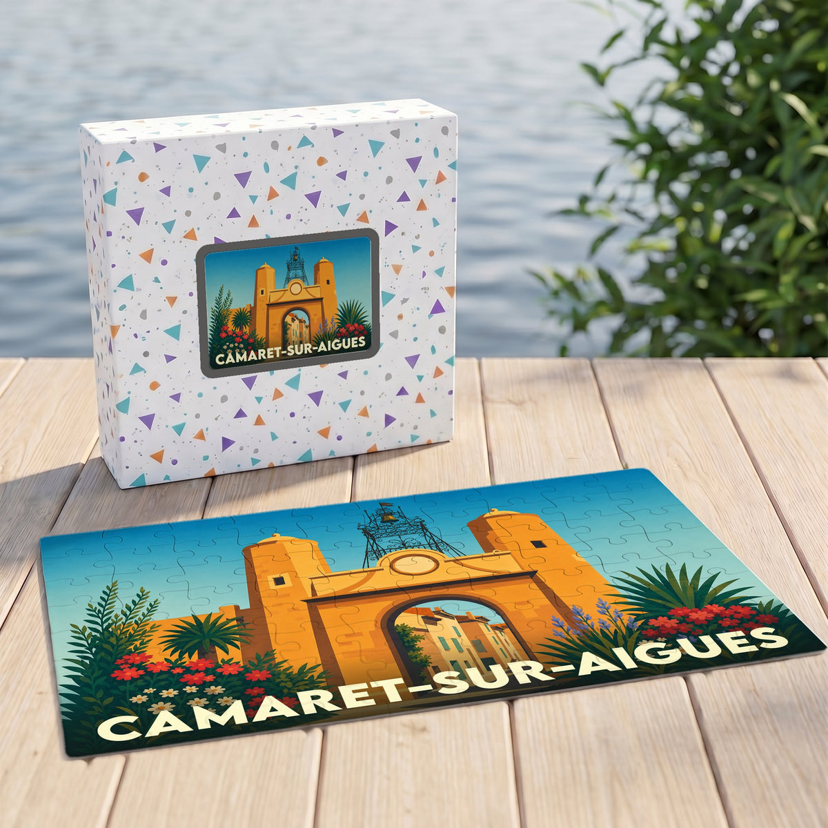 Puzzle souvenir de la ville de Camaret-sur-Aigues avec une illustration stylisée de son patrimoine architectural.