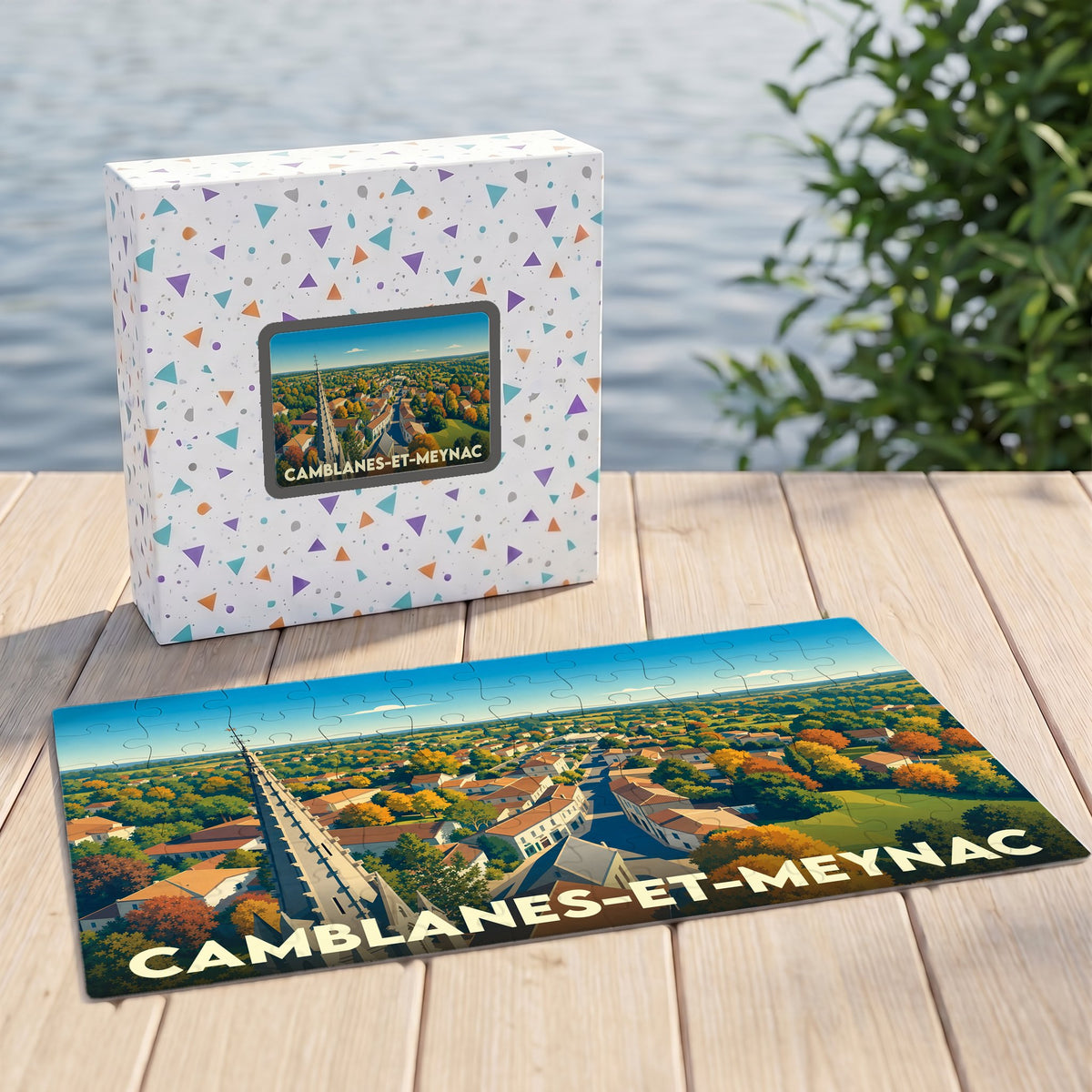 Puzzle souvenir de la ville de Camblanes-et-Meynac illustré par une vue aérienne stylisée.