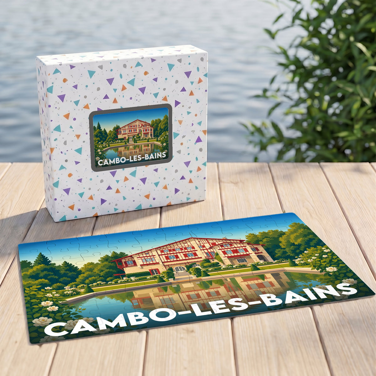 Puzzle souvenir de la ville de Cambo-les-Bains avec une illustration stylisée d'une villa basque au bord de l'eau.