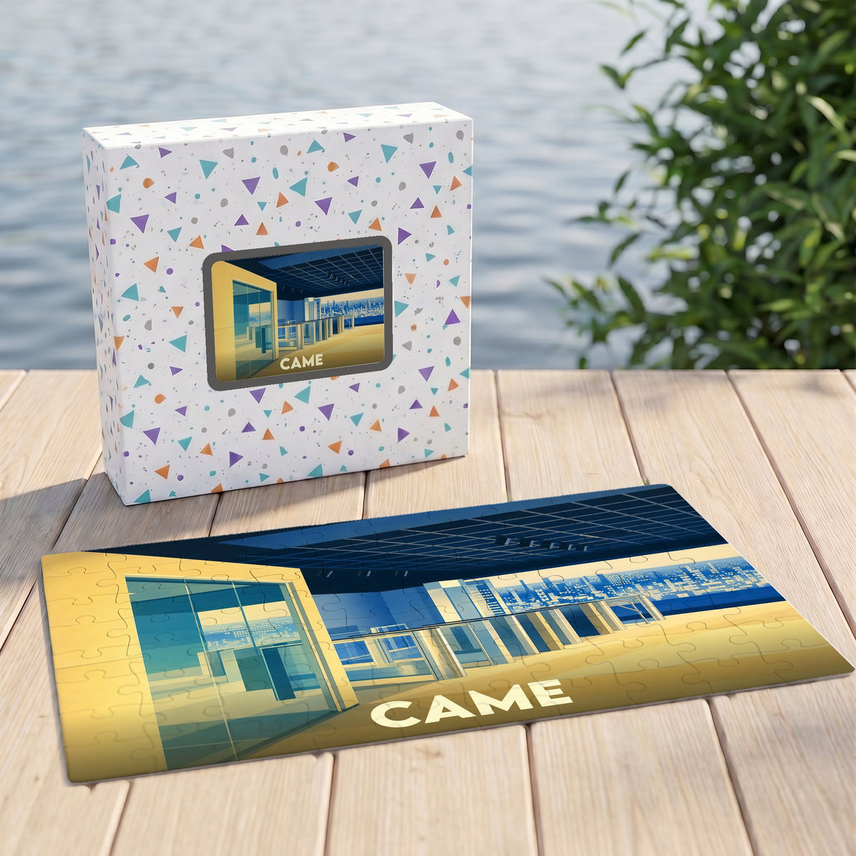Puzzle souvenir de la ville de Came avec une illustration stylisée et sa boîte assortie.