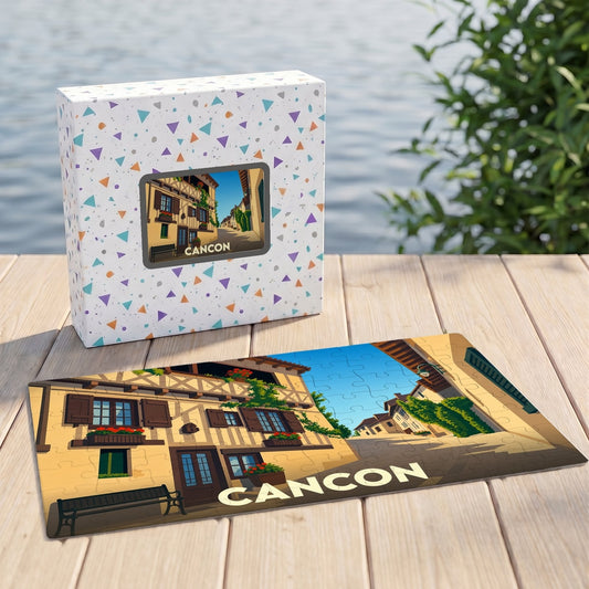Puzzle souvenir de la ville de Cancon avec une illustration stylisée de ses maisons à colombages.