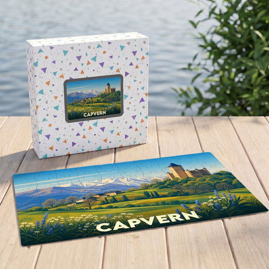 Puzzle souvenir de la ville de Capvern présentant une illustration stylisée d'un paysage montagneux avec un château.