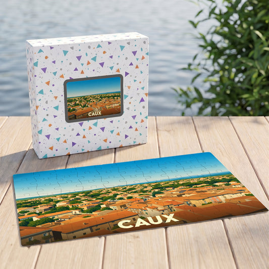 Puzzle souvenir de la ville de Caux représentant une vue aérienne illustrée de ses toits.