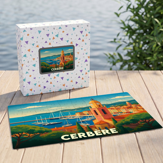 Puzzle souvenir de la ville de Cerbère avec une illustration stylisée de son port et de son clocher.