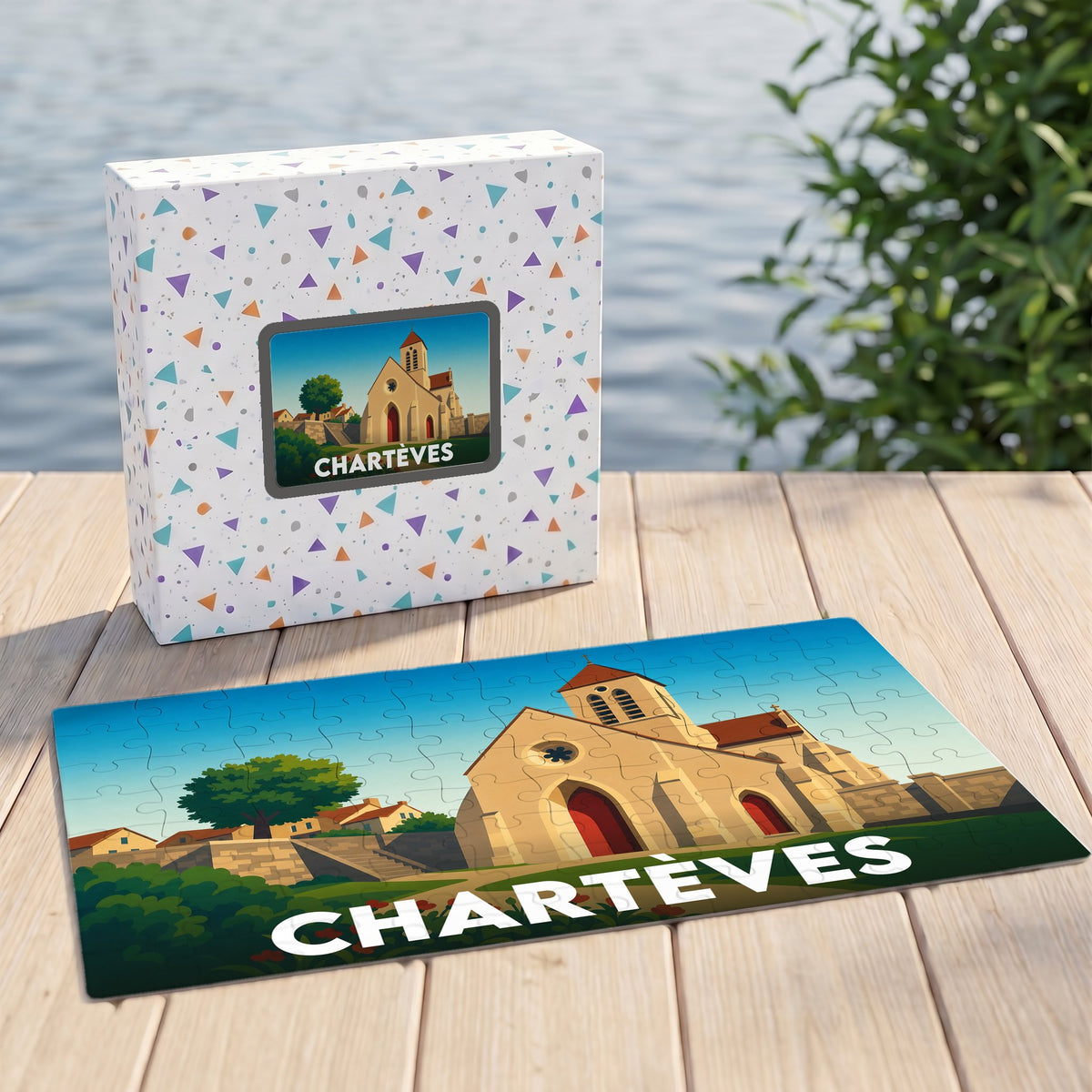Puzzle souvenir de la ville de Chartèves présentant une illustration stylisée de son église sur sa boîte et en version assemblée.