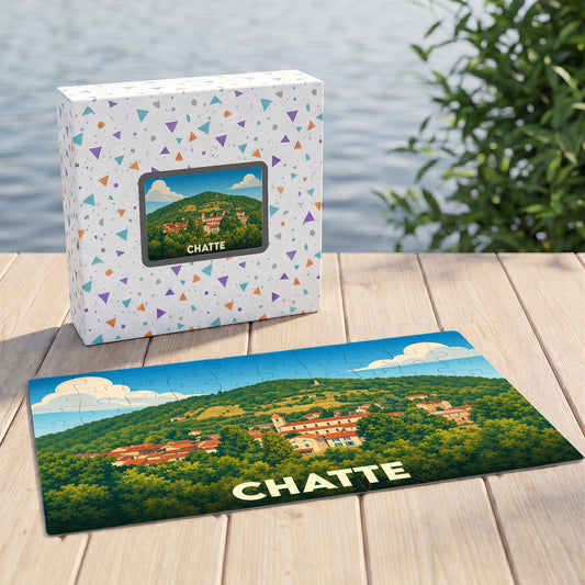 Puzzle souvenir de la ville de Chatte avec une illustration stylisée de son paysage vallonné.