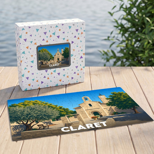 Puzzle souvenir de la ville de Claret avec une illustration stylisée de son église sous un ciel bleu.