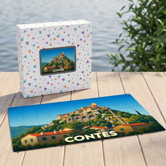 Puzzle souvenir de la ville de Contes avec une illustration stylisée d'un village perché.