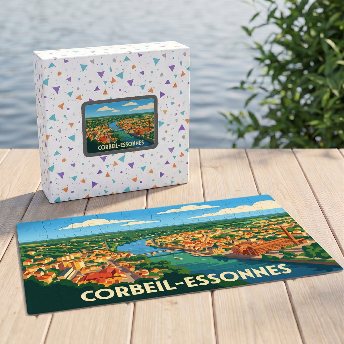 Puzzle souvenir de la ville de Corbeil-Essonnes illustré d'une vue aérienne stylisée au bord de l'eau.