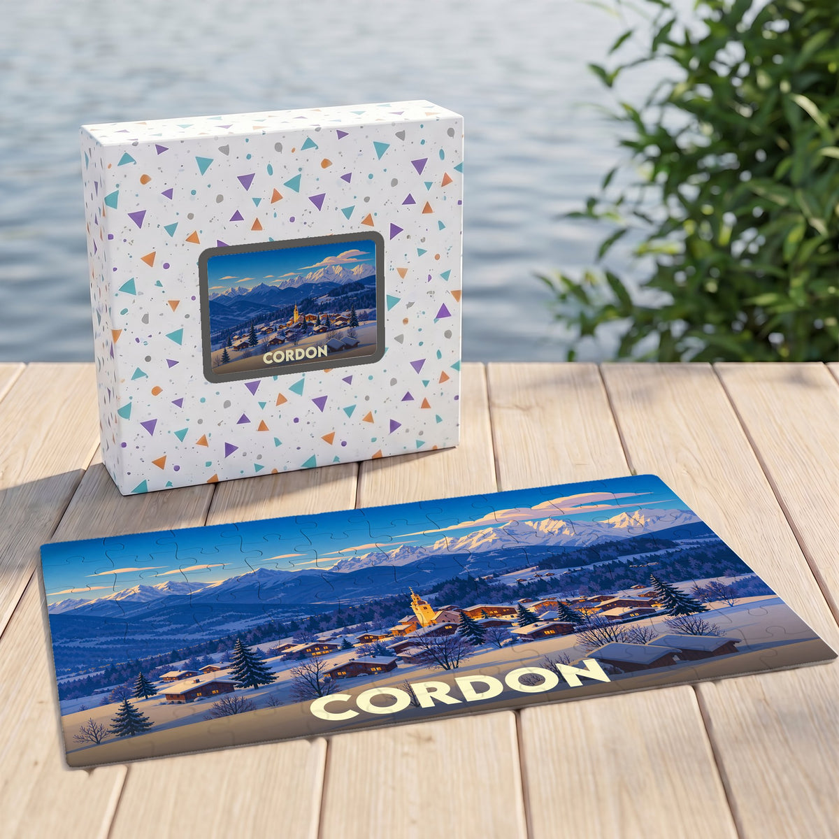 Puzzle souvenir de la ville de Cordon avec une illustration hivernale stylisée des montagnes.