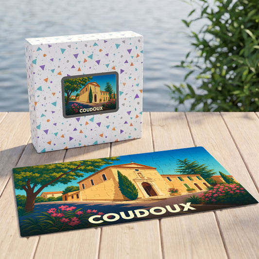 Puzzle souvenir de la ville de Coudoux avec une illustration stylisée d'un bâtiment provençal.