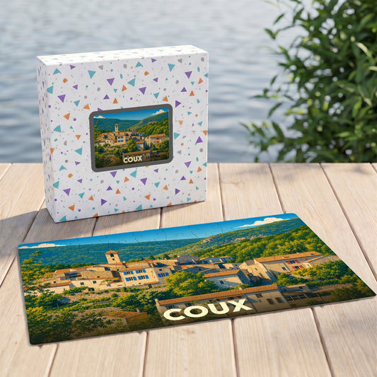 Puzzle souvenir de la ville de Coux avec une illustration paysagère stylisée.