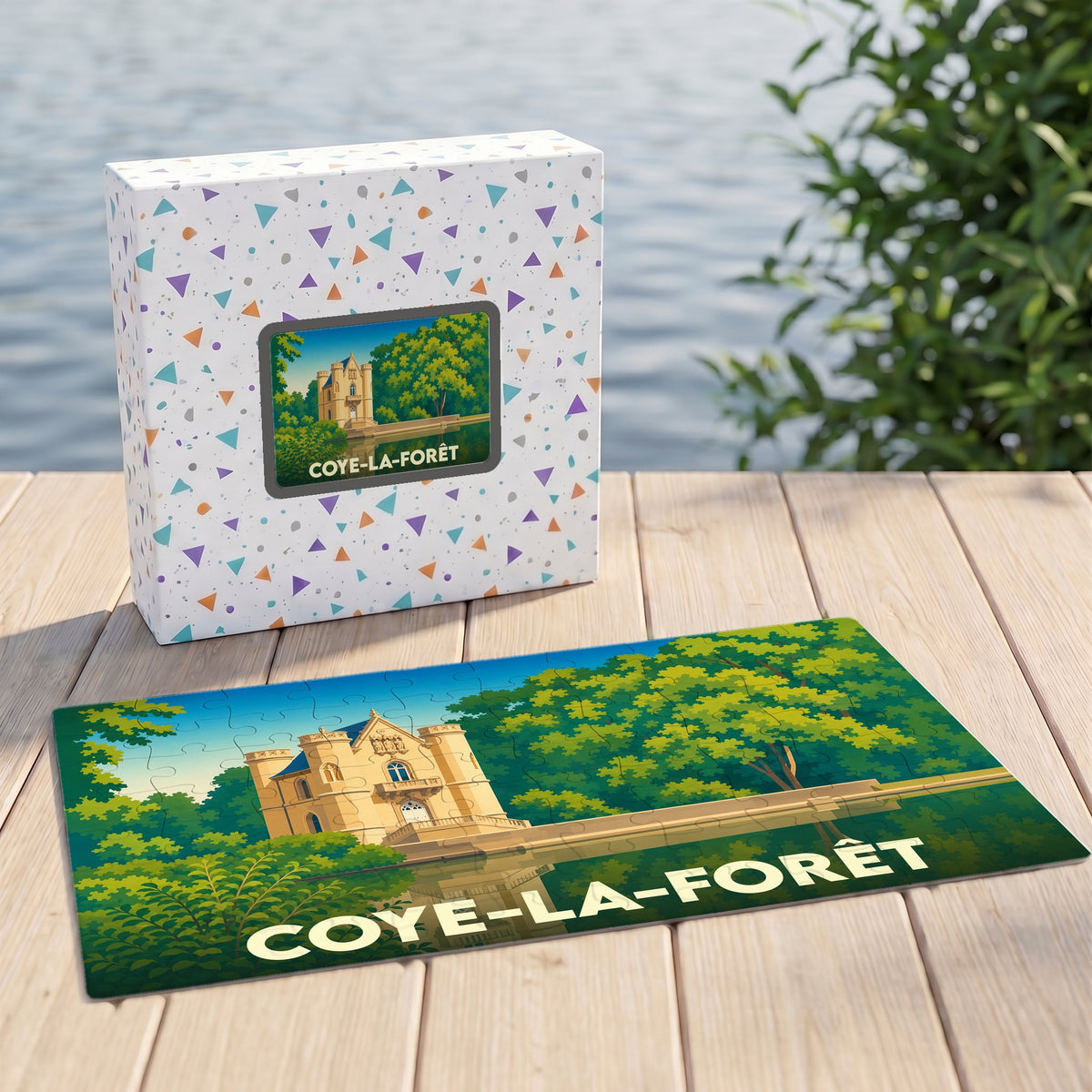 Puzzle souvenir de la ville de Coye-la-Forêt illustré d'un château stylisé dans un écrin de verdure.