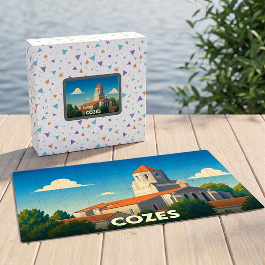 Puzzle souvenir de la ville de Cozes avec une illustration stylisée de son église, présenté devant sa boîte.