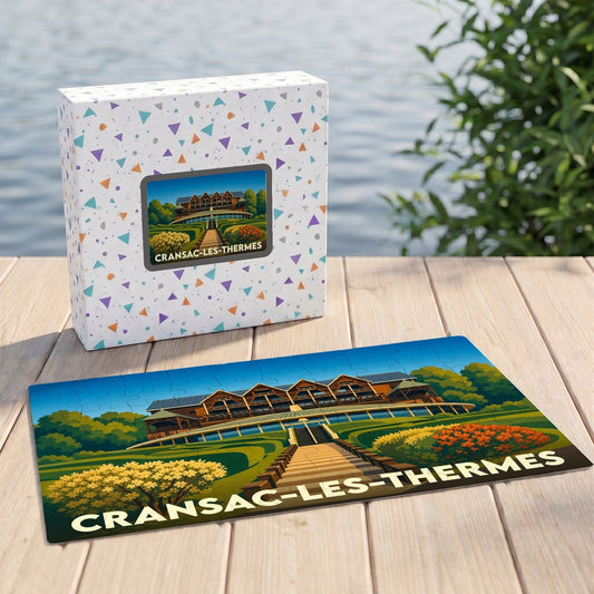 Puzzle souvenir de la ville de Cransac-les-Thermes avec une illustration stylisée de son établissement thermal.