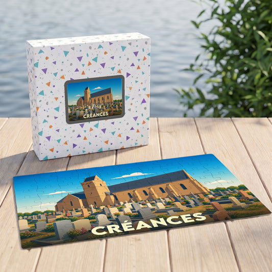 Puzzle souvenir de la ville de Créances représentant son église et son cimetière dans un style illustré.