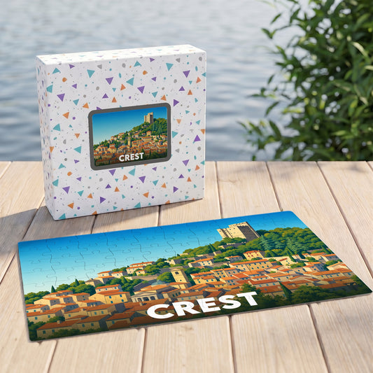 Puzzle souvenir de la ville de Crest avec une illustration stylisée d'un village perché.