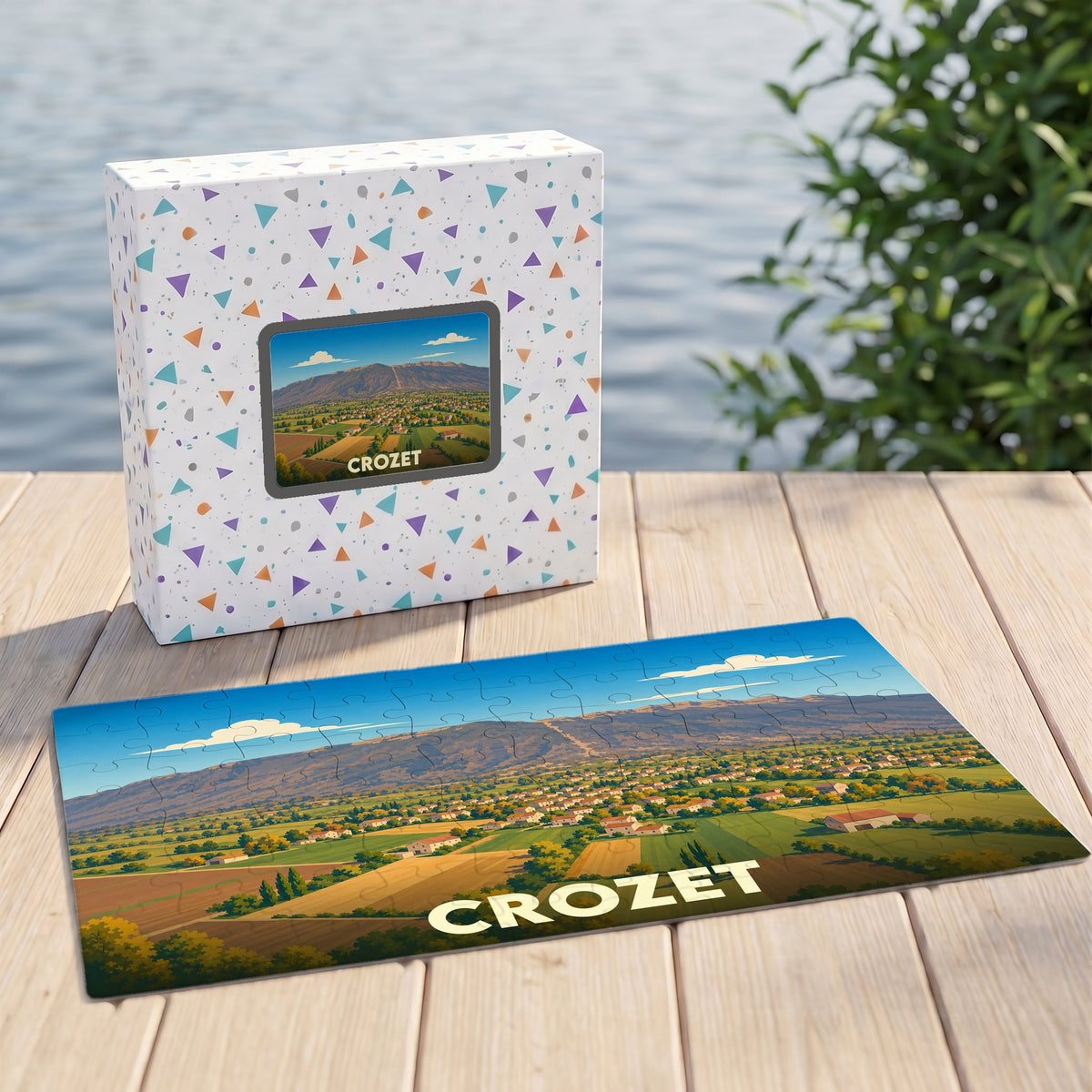 Puzzle souvenir de la ville de Crozet avec une illustration panoramique de ses paysages.