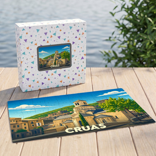 Puzzle souvenir de la ville de Cruas avec une illustration stylisée de son patrimoine architectural.