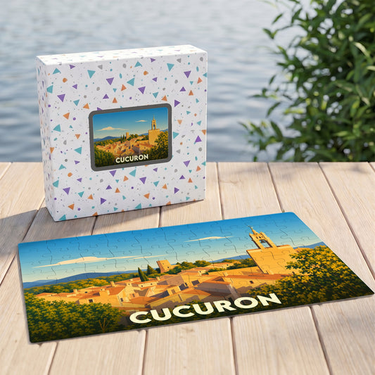 Puzzle souvenir de la ville de Cucuron avec une illustration stylisée d'un paysage provençal.