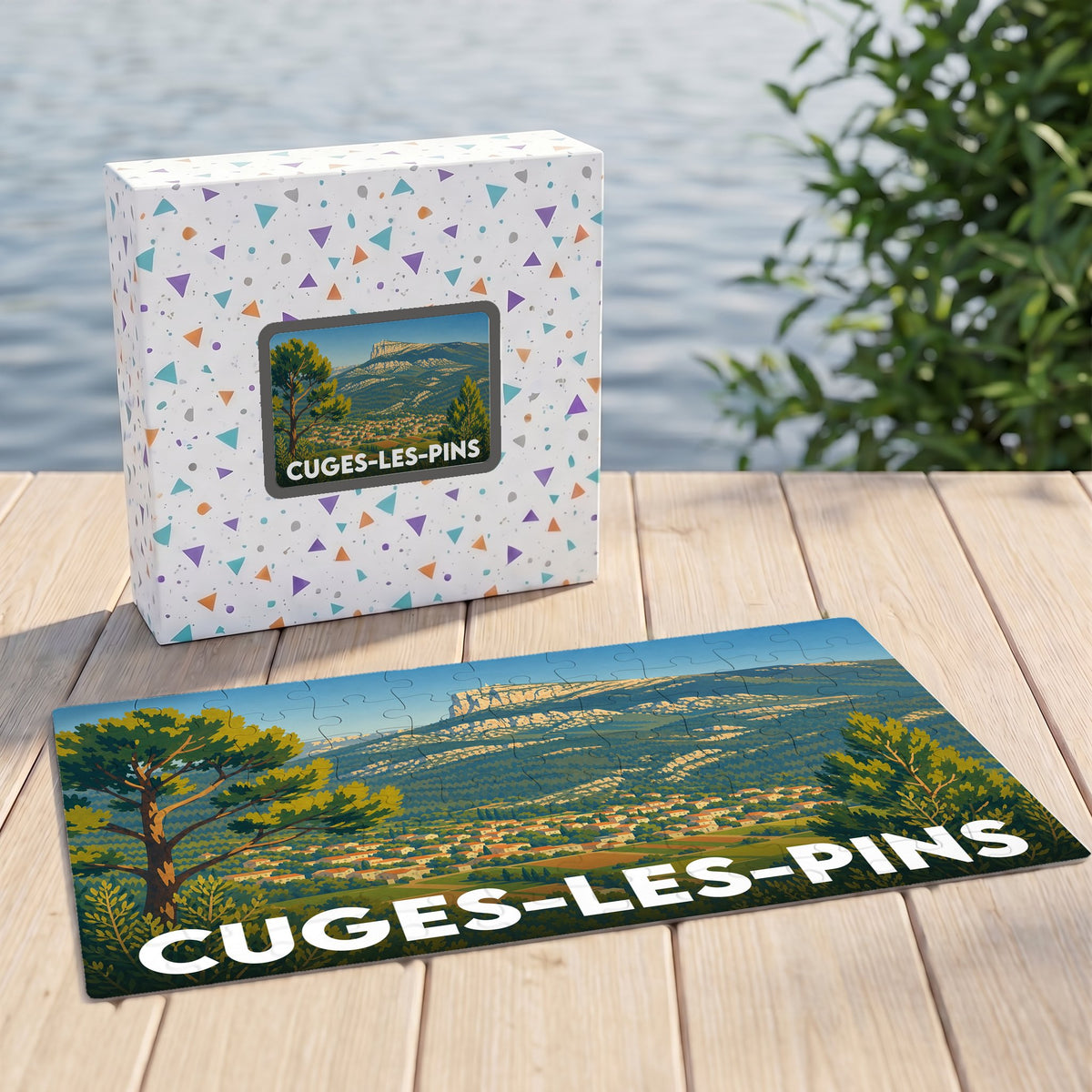 Puzzle souvenir de la ville de Cuges-les-Pins avec une illustration de paysage montagneux.