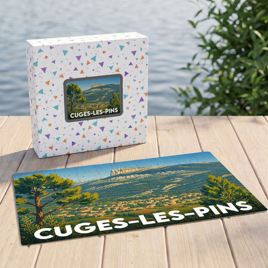 Puzzle souvenir de la ville de Cuges-les-Pins avec une illustration de paysage montagneux.