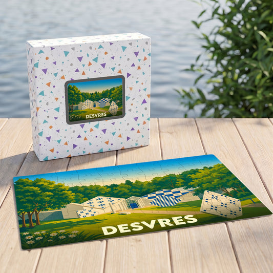 Puzzle souvenir de la ville de Desvres avec une illustration stylisée d'un paysage verdoyant.