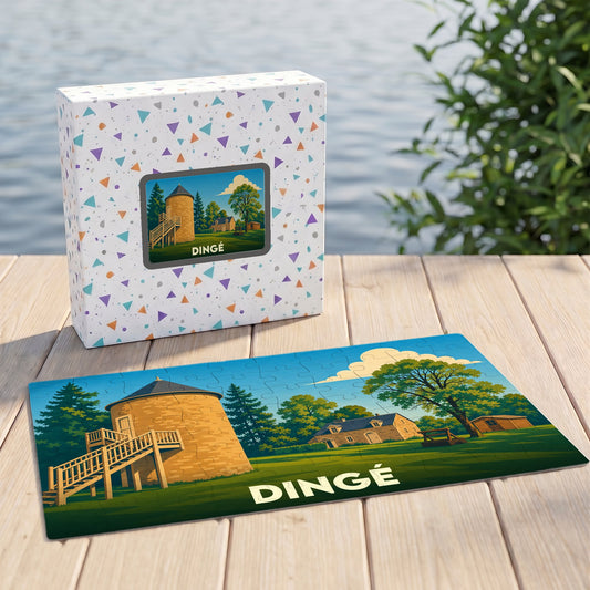 Puzzle souvenir de la ville de Dingé représentant une illustration stylisée d'un bâtiment historique dans un paysage verdoyant.
