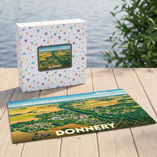 Puzzle souvenir de la ville de Donnery avec une illustration aérienne colorée.