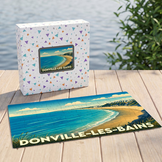 Puzzle souvenir de la ville de Donville-les-Bains avec une illustration stylisée de sa plage et de son littoral.