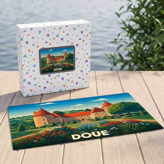 Puzzle souvenir de la ville de Doué illustrant un château entouré de jardins fleuris.