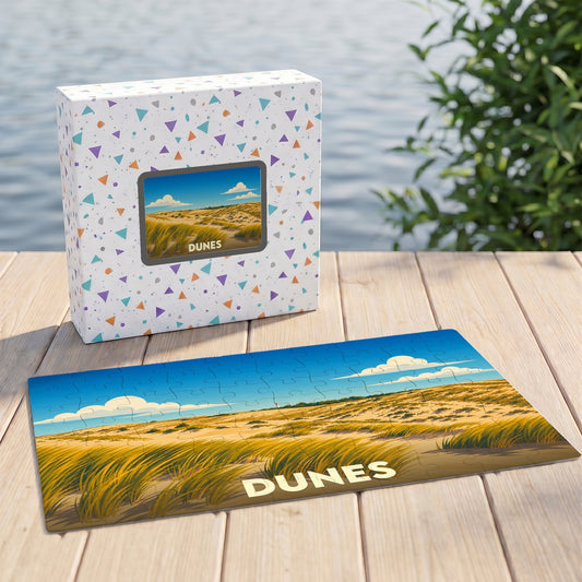 Puzzle souvenir de la ville de Dunes avec une illustration stylisée de paysage dunaire.