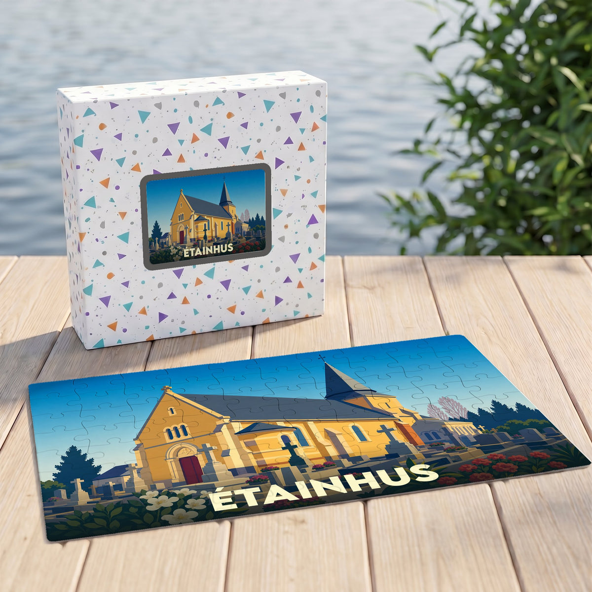 Puzzle souvenir de la ville d'Étainhus avec une illustration stylisée d'une église et de son cimetière.